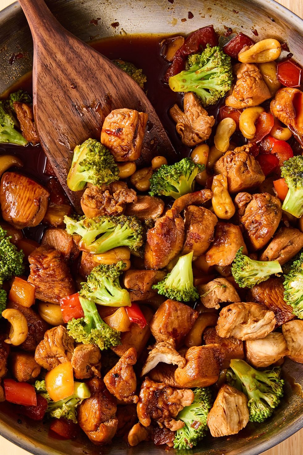 Chicken Stir Fry in a pan with a wooden spoon