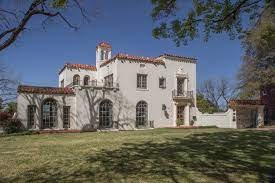 Photo of a white Spanish Revival haome.