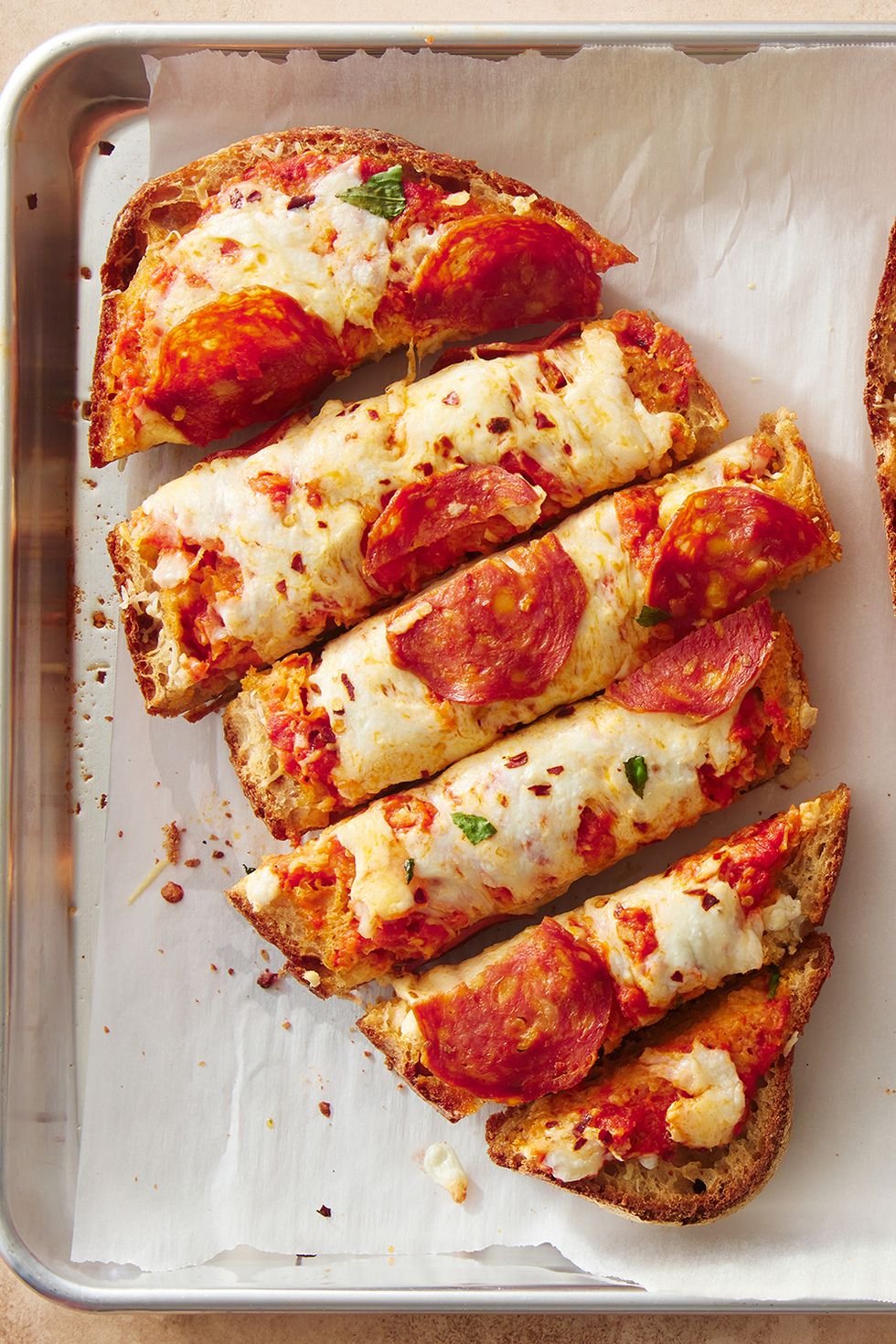 Pepperoni pizza on a baking sheet