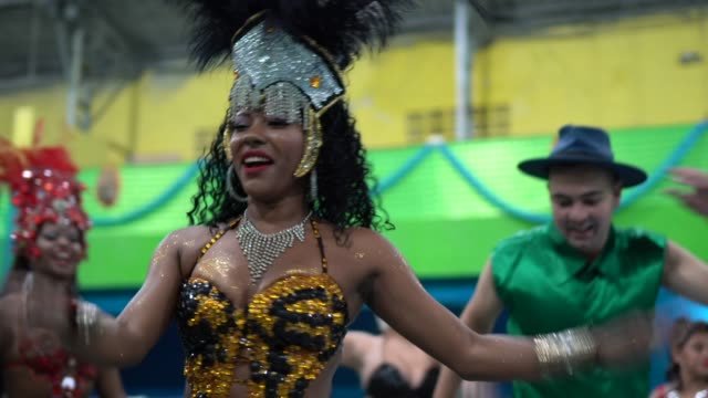 A group of individuals dressed in Carnival outfits