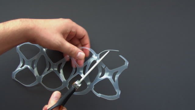 Cutting plastic six-pack rings