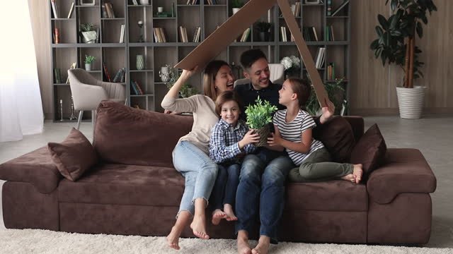 A family sitting on a couch