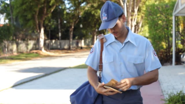 A mailman delivering mail 