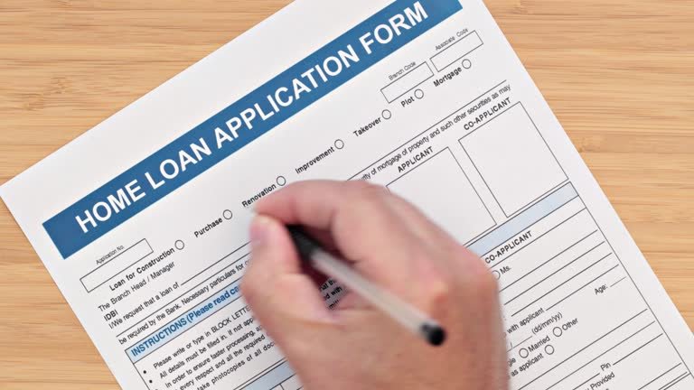 A person filling out a loan application