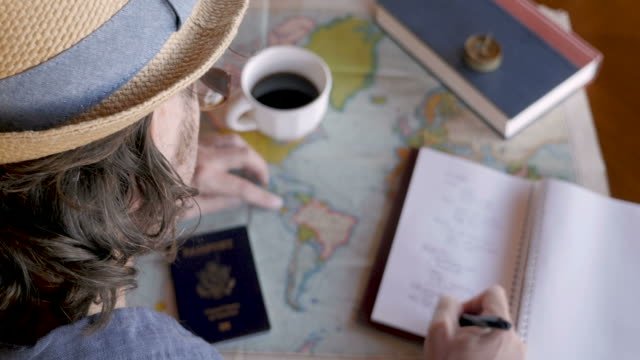 A person journaling about travel destinations 